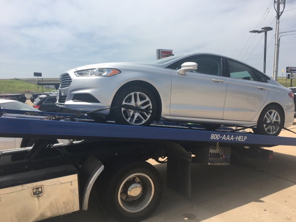 Rental car on a tow truck.