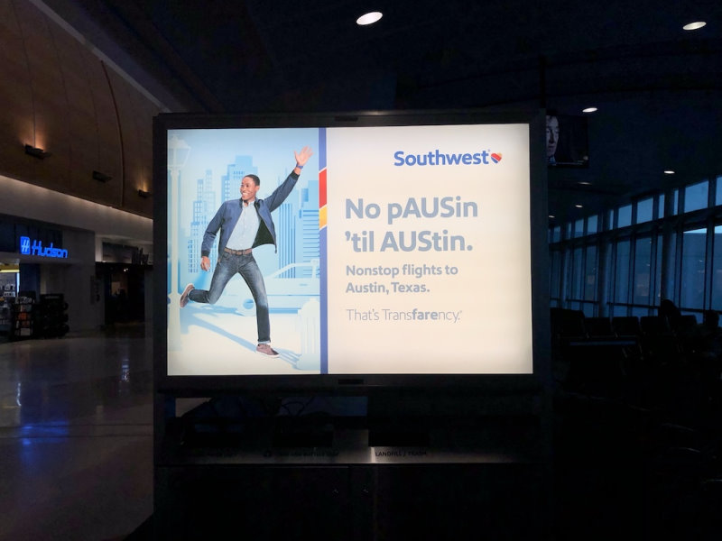 An airport sign, advertising nonstop flights to Austin, Texas.