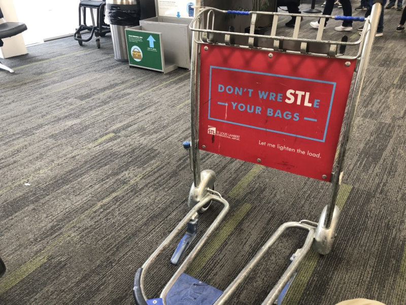 Sign on a luggage cart.