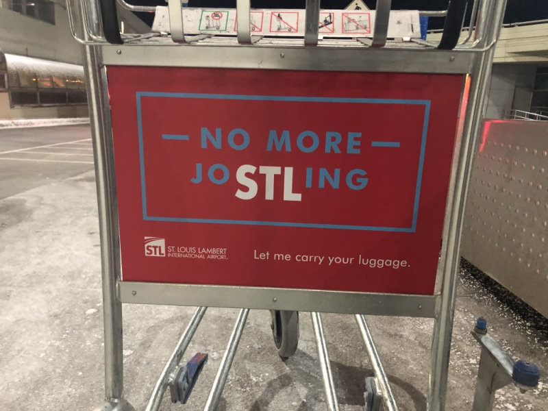 Sign on a luggage cart.