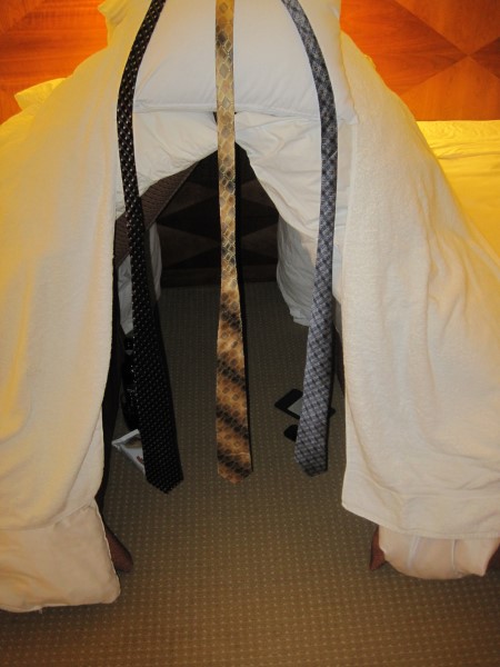 Entrance to the pillow fort, draped with neckties.