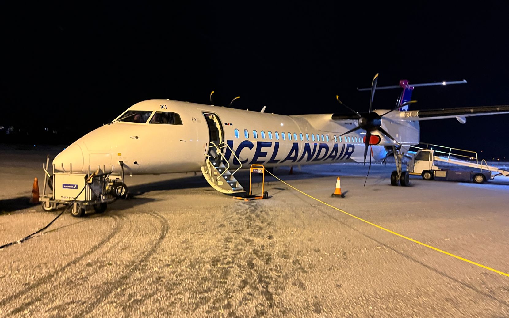 Icelandair DHC-8-400 parked on a snowy ramp.