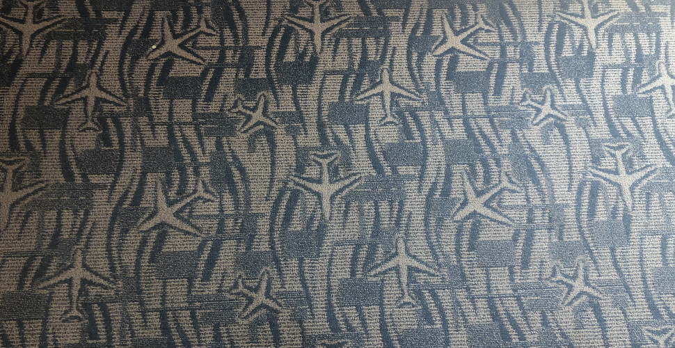 Carpet with an airplane pattern.