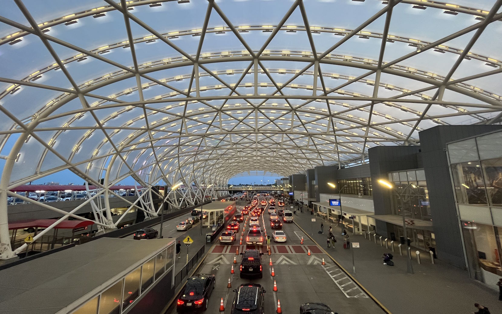 Metal tunnel structure over the south terminal departures roadway.