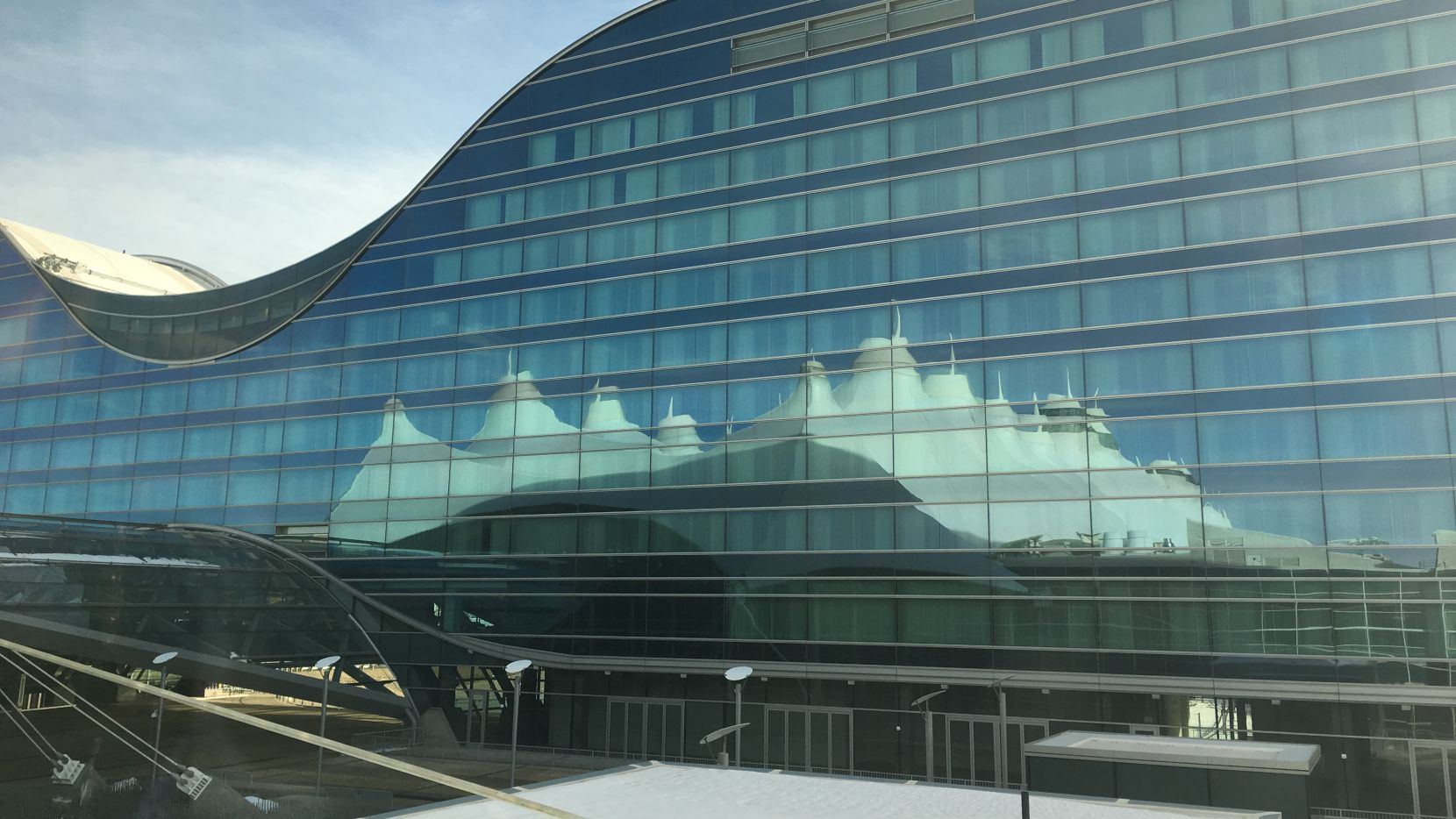 Reflection of the Denver terminal in the windows of its Westin hotel.