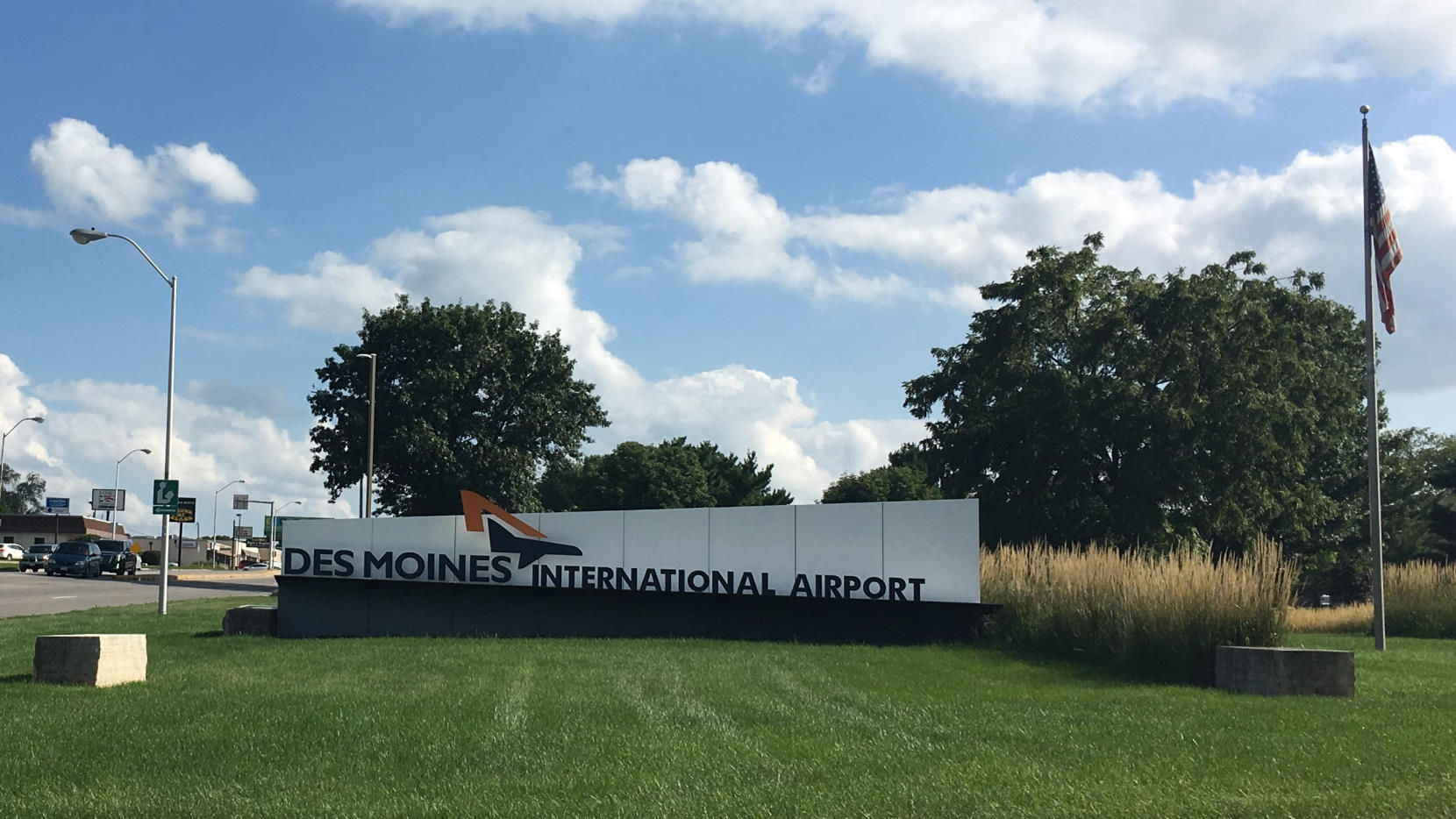 Des Moines International Airport sign on the airport's front lawn.
