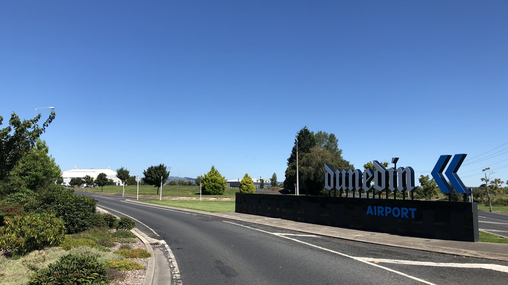 Dunedin Airport roadside entry sign.