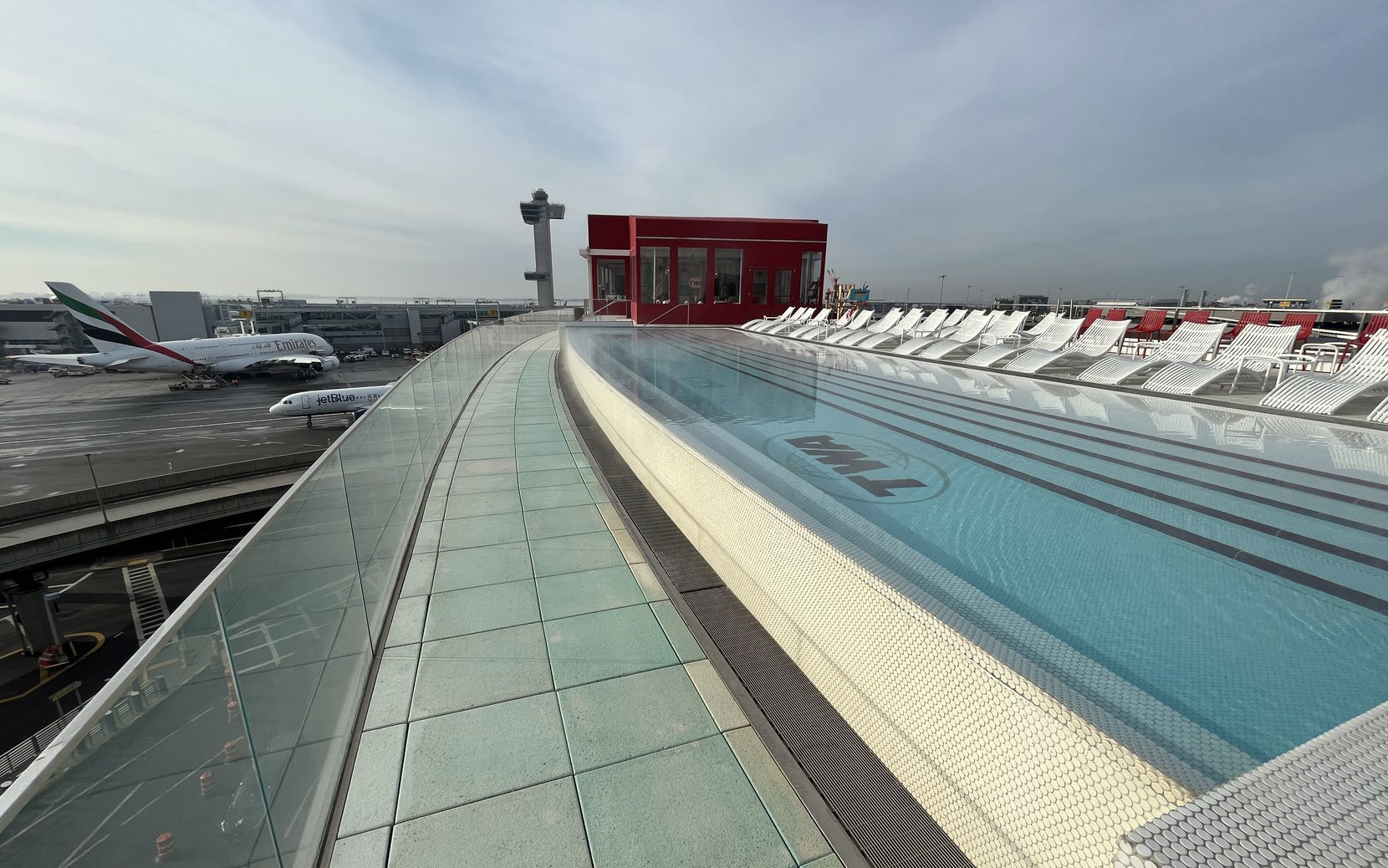 A rooftop pool overlooking the JFK airport.