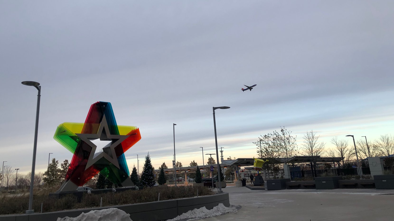 Mall of America sign with a jet taking off in the background.