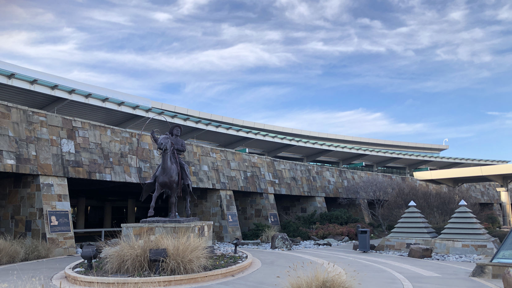 Statue of Will Rogers on a horse in front of OKC terminal.