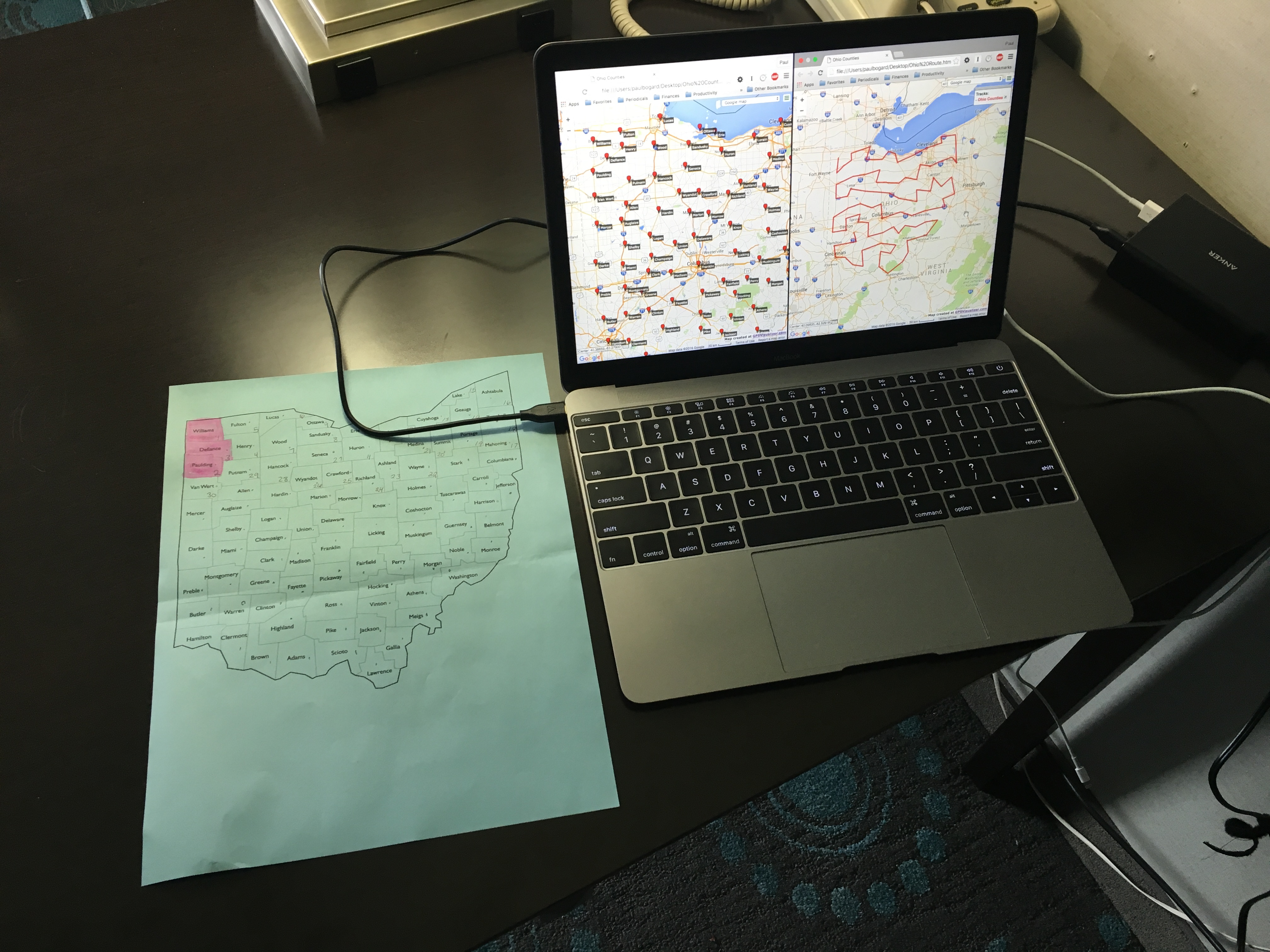 Laptop showing a Google Maps waypoint map, and a printed out map of Ohio counties.