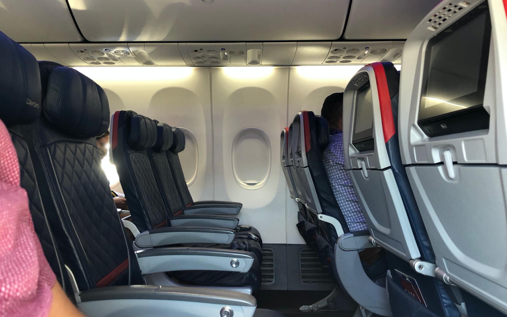 A Boeing 737 row, with all six seats empty except for the one Paul is sitting in.