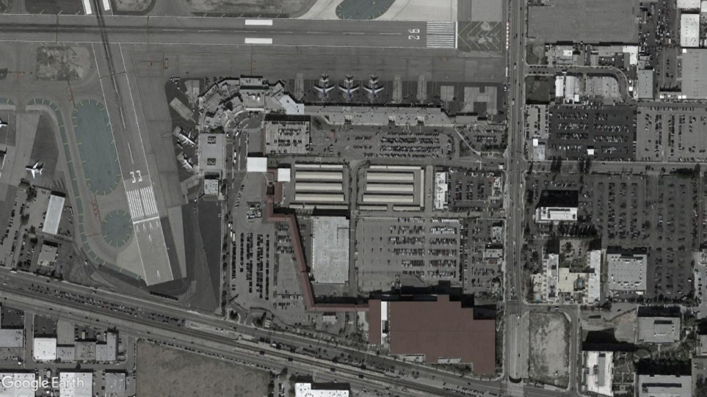 Aerial imagery of BUR, showing the terminal boxed in between two cross runways and two cross roads.