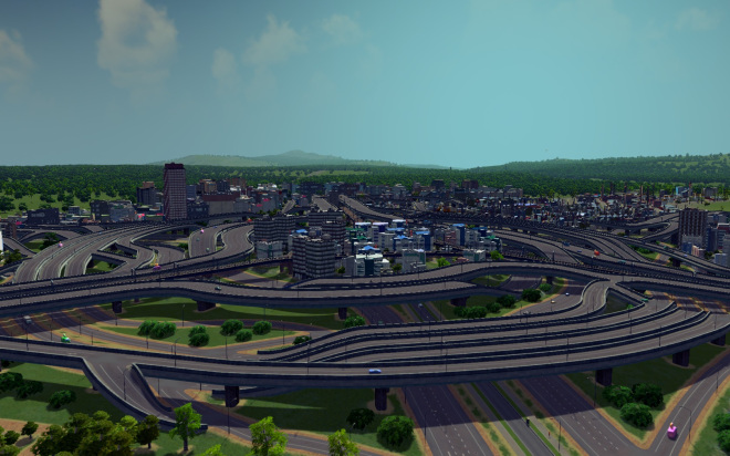 The same 6-way turbine road interchange in Cities: Skylines, viewed from a shallow angle.