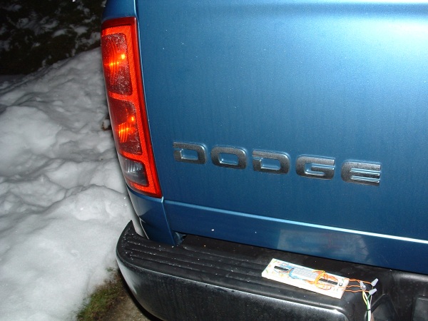 A breadboard wired to the truck's trailer connector cable.