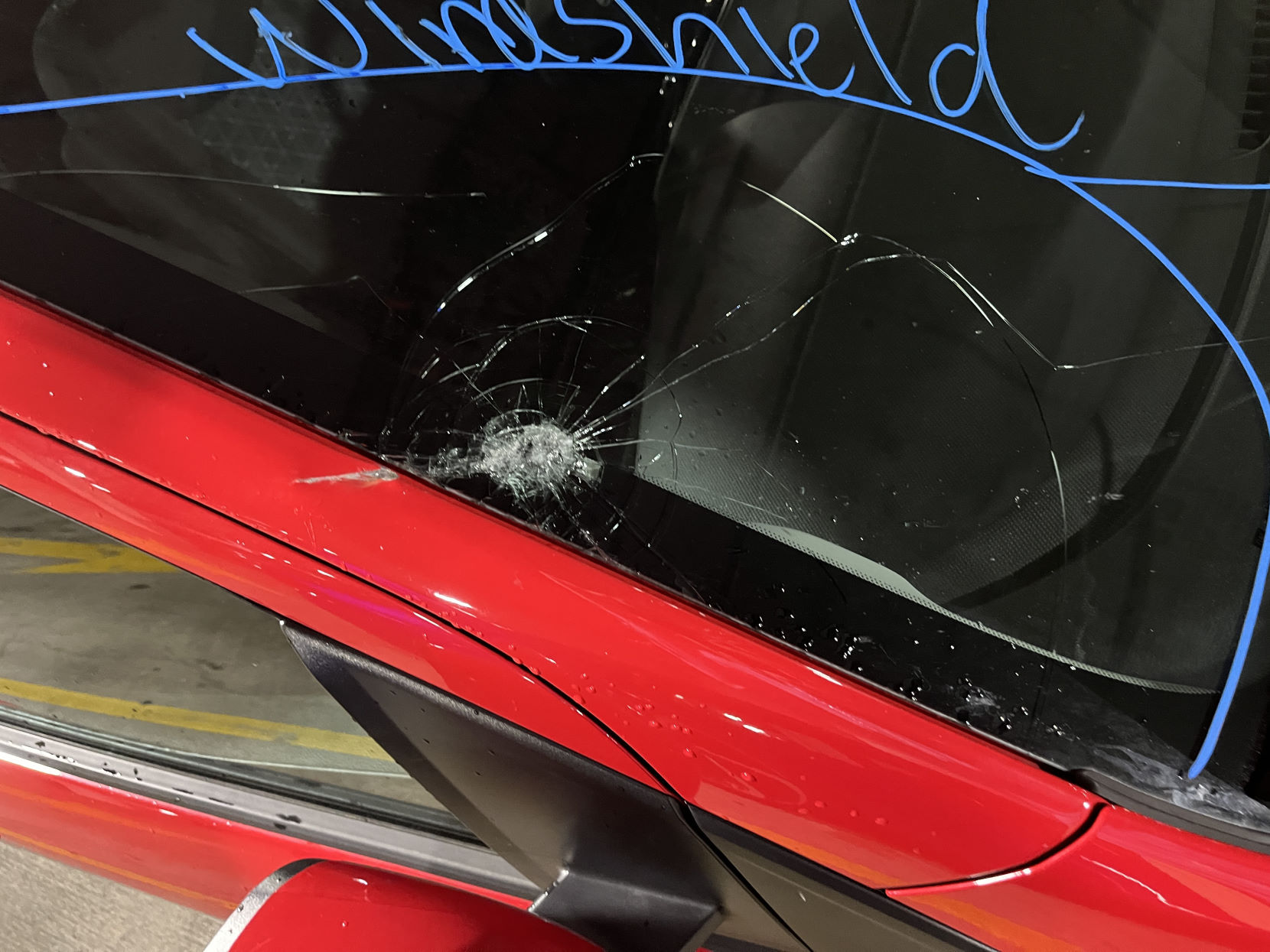 A damaged car windshield.